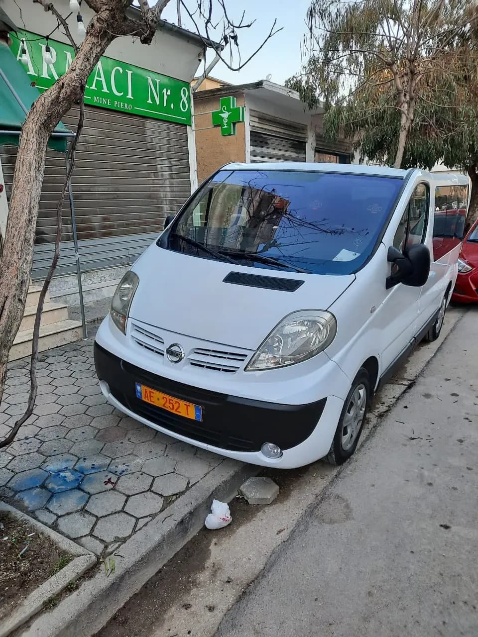 The white passenger van used by Dhermi Taxi for larger groups